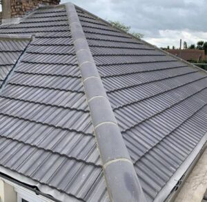 A grey tiled pitched roof installed on a residential property in Guildford.
