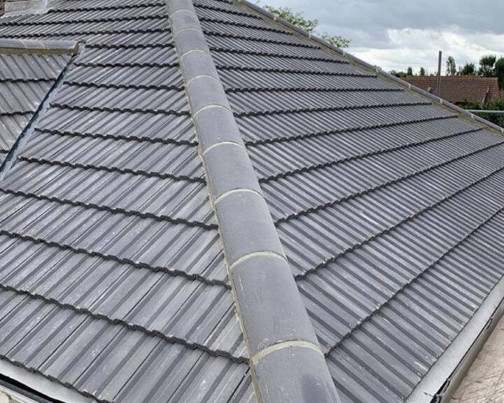 A grey tiled pitched roof installed on a residential property in Guildford.