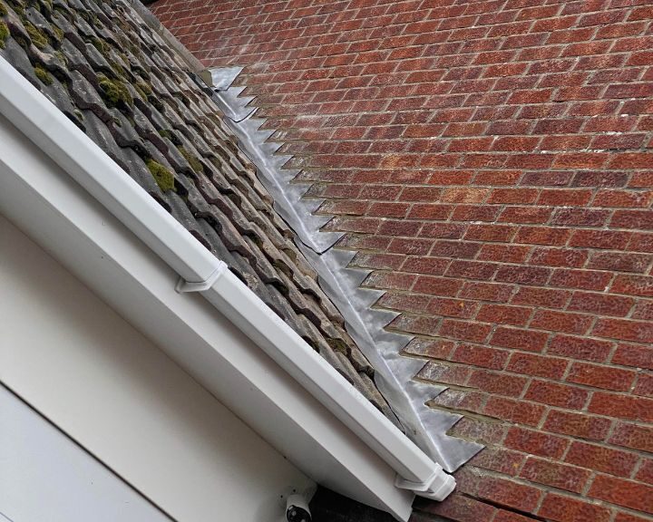 New lead flashing installed on a garage roof in Guildford.