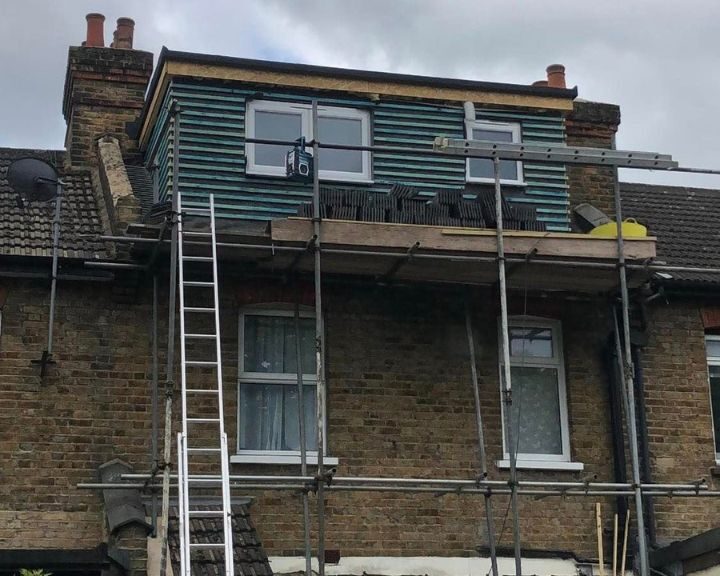A dormer loft conversion having new cladding installed as part of a roof repair.